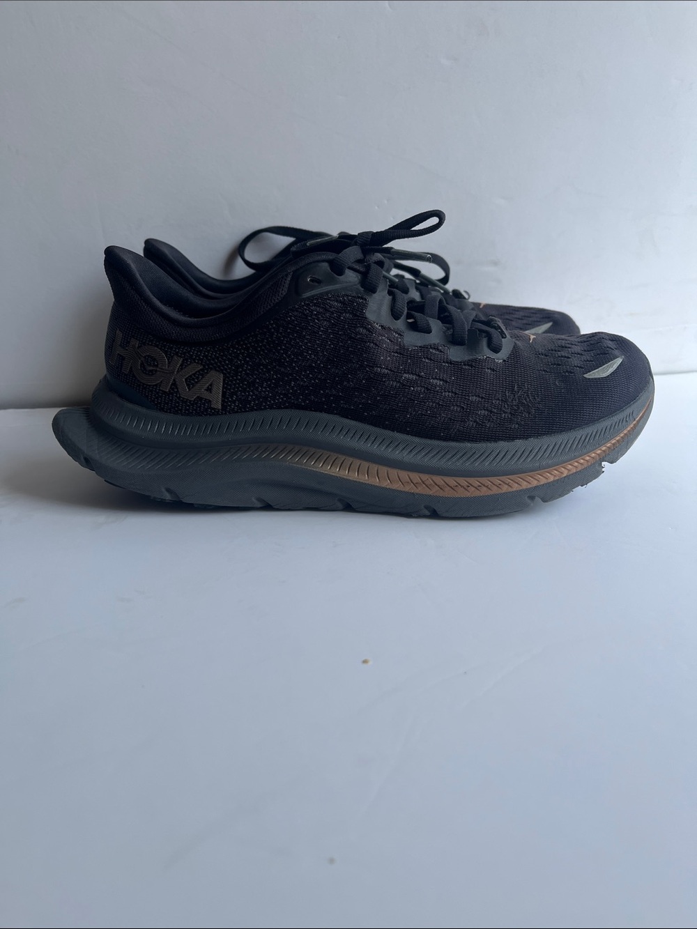 Hoka Black Running Shoes with Bronze Stripe